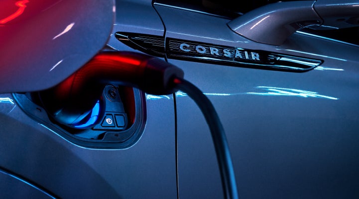 A charger plugged into the charging port of a 2024 Lincoln Corsair® Plug-in Hybrid model. | Lidtke Lincoln in Beaver Dam WI