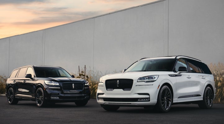 Two Lincoln Aviator® SUVs are shown with the available Jet Appearance Package | Lidtke Lincoln in Beaver Dam WI