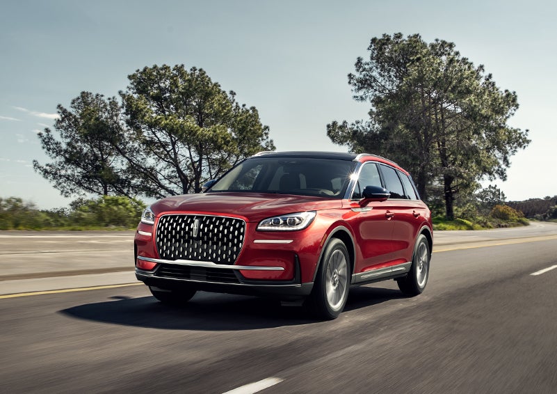 A 2024 Lincoln Corsair® SUV is shown being driven on a country road. | Lidtke Lincoln in Beaver Dam WI