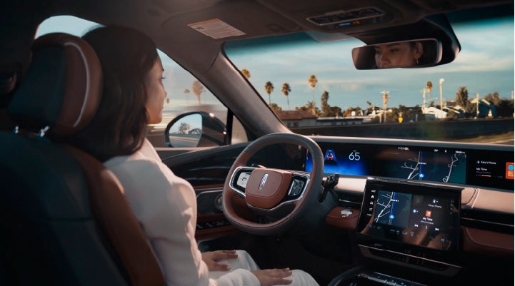 A person is shown driving hands-free on the highway with available Lincoln BlueCruise technology. | Lidtke Lincoln in Beaver Dam WI