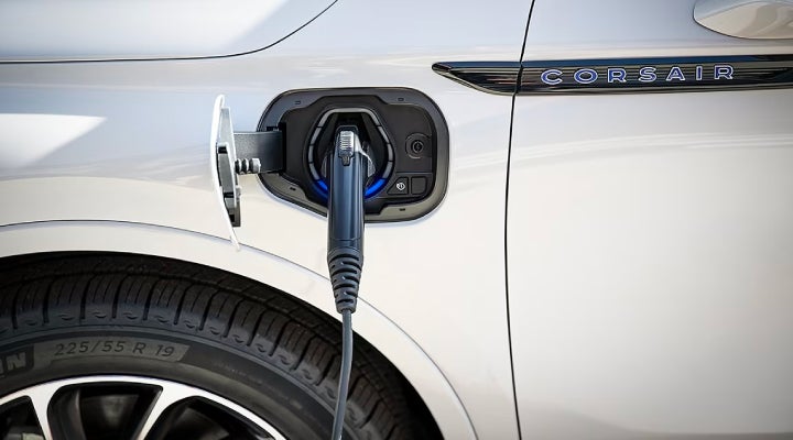 An electric charger is shown plugged into the charging port of a Lincoln Corsair® Grand Touring
model. | Lidtke Lincoln in Beaver Dam WI